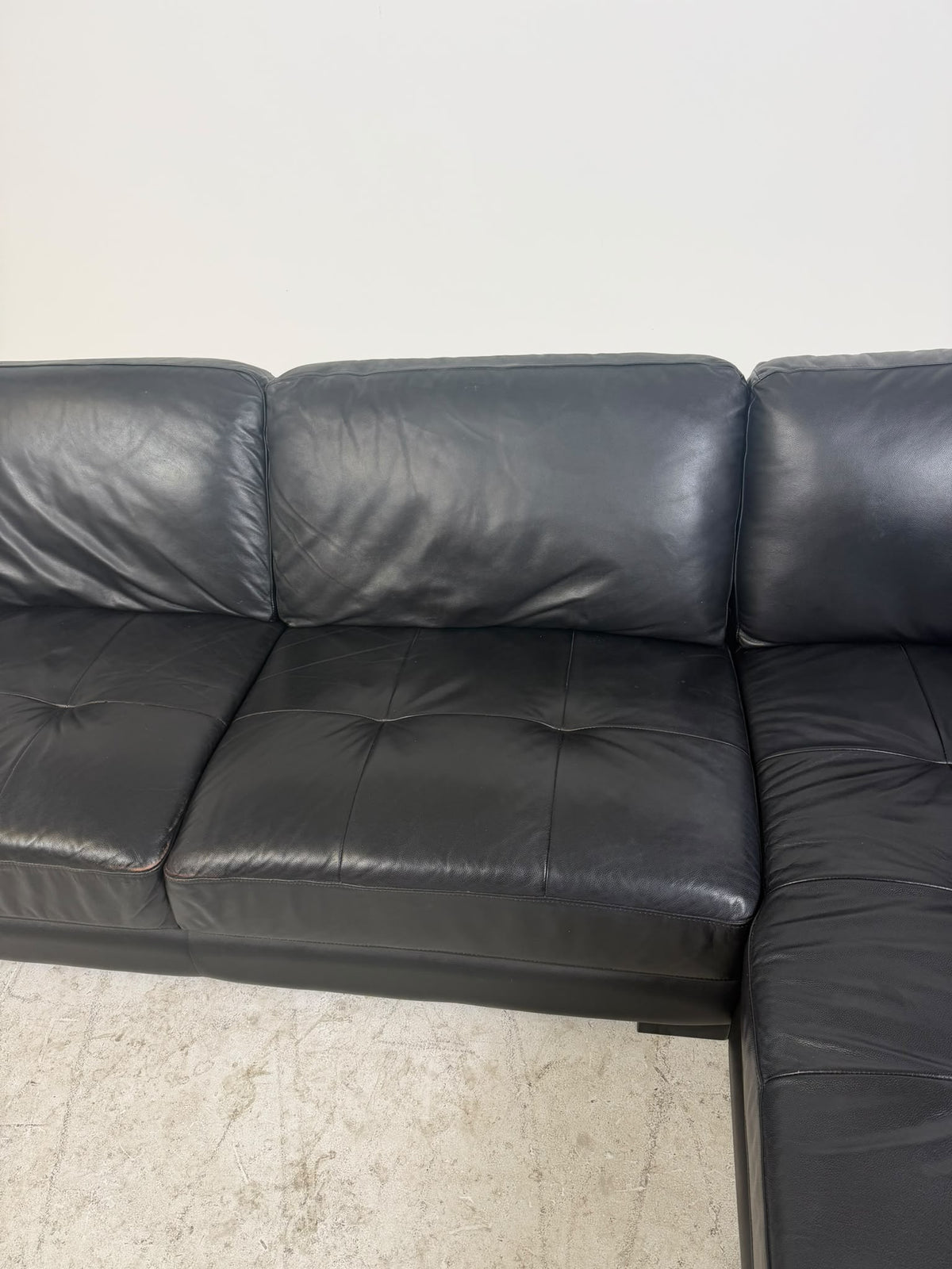Urban Barn Leather Sectional. Black L shaped sofa couch. Delivery available