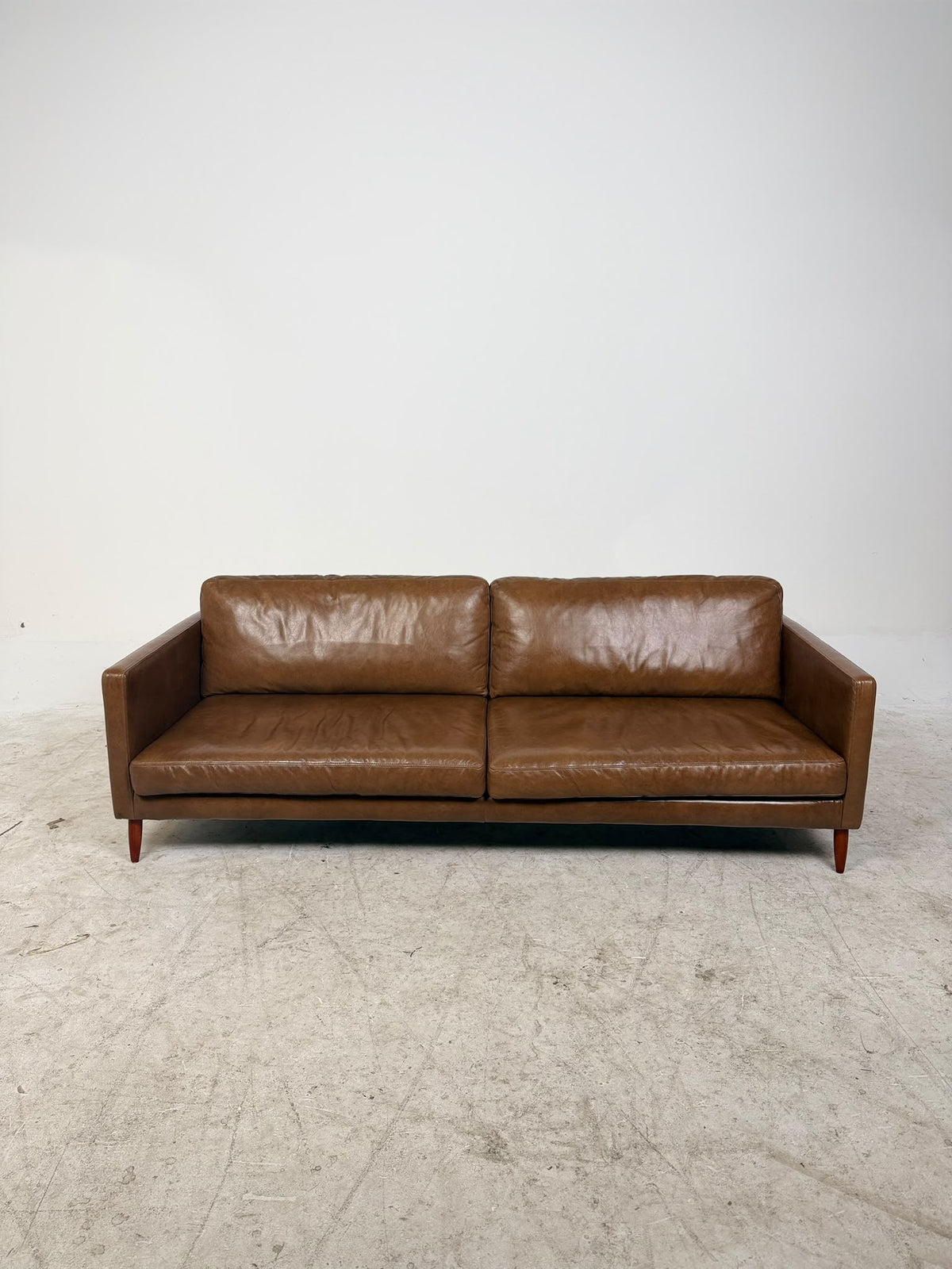 MCM Brown leather Sofa from Article. Down filled Couch. Delivery available