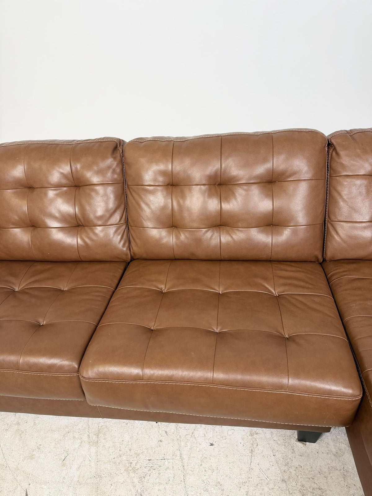 Ashley's Furniture Leather Sectional. Cognac L shaped sofa couch. Delivery available