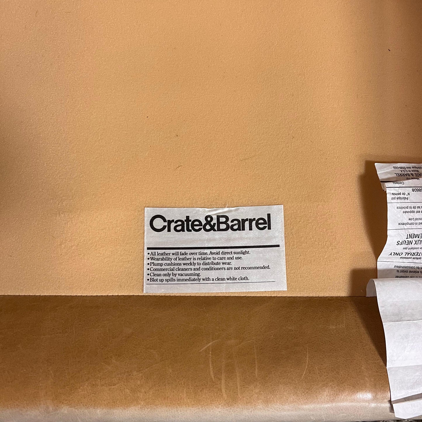 Crate and barrel caramel leather chair.