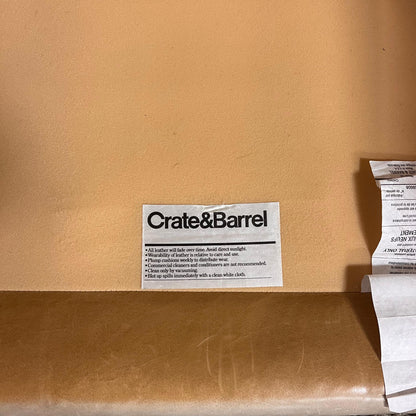 Crate and barrel caramel leather chair.