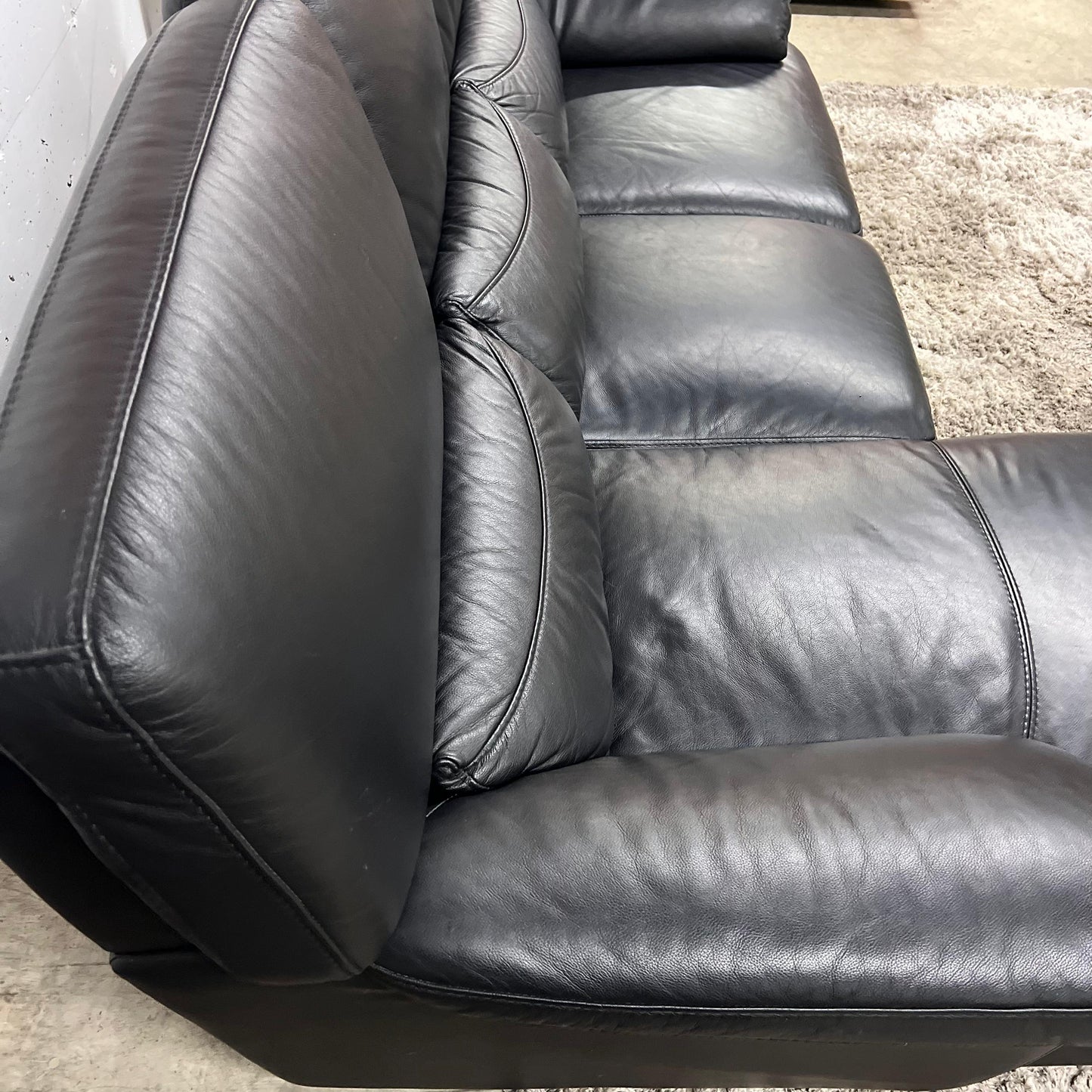 Black leather sectional. L shaped sofa couch. Delivery available