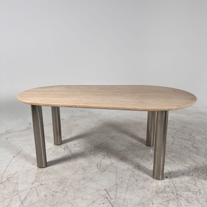 New Moe's fia dining table. travertine. Retails for $3199