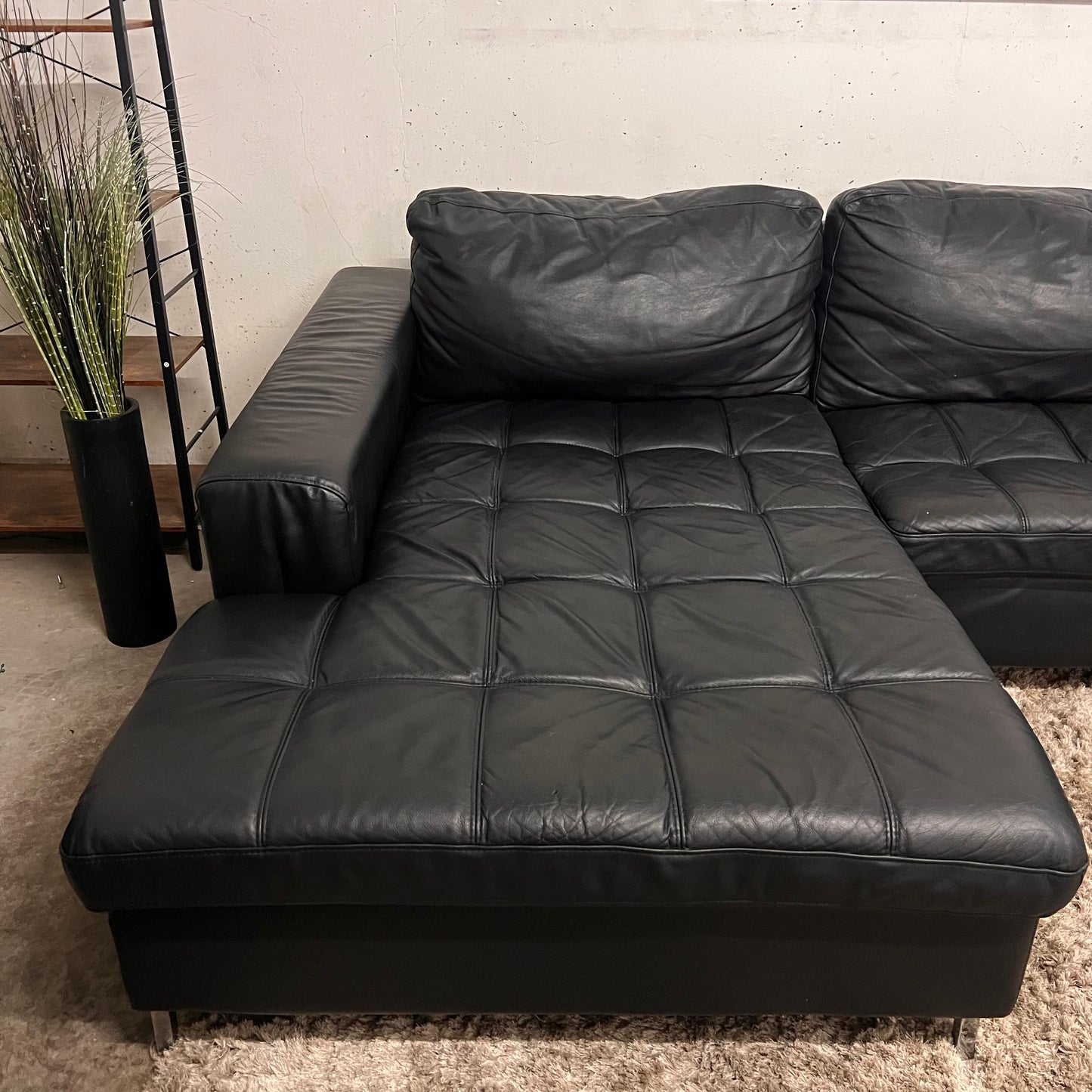 Black leather sectional. L shaped sofa couch.