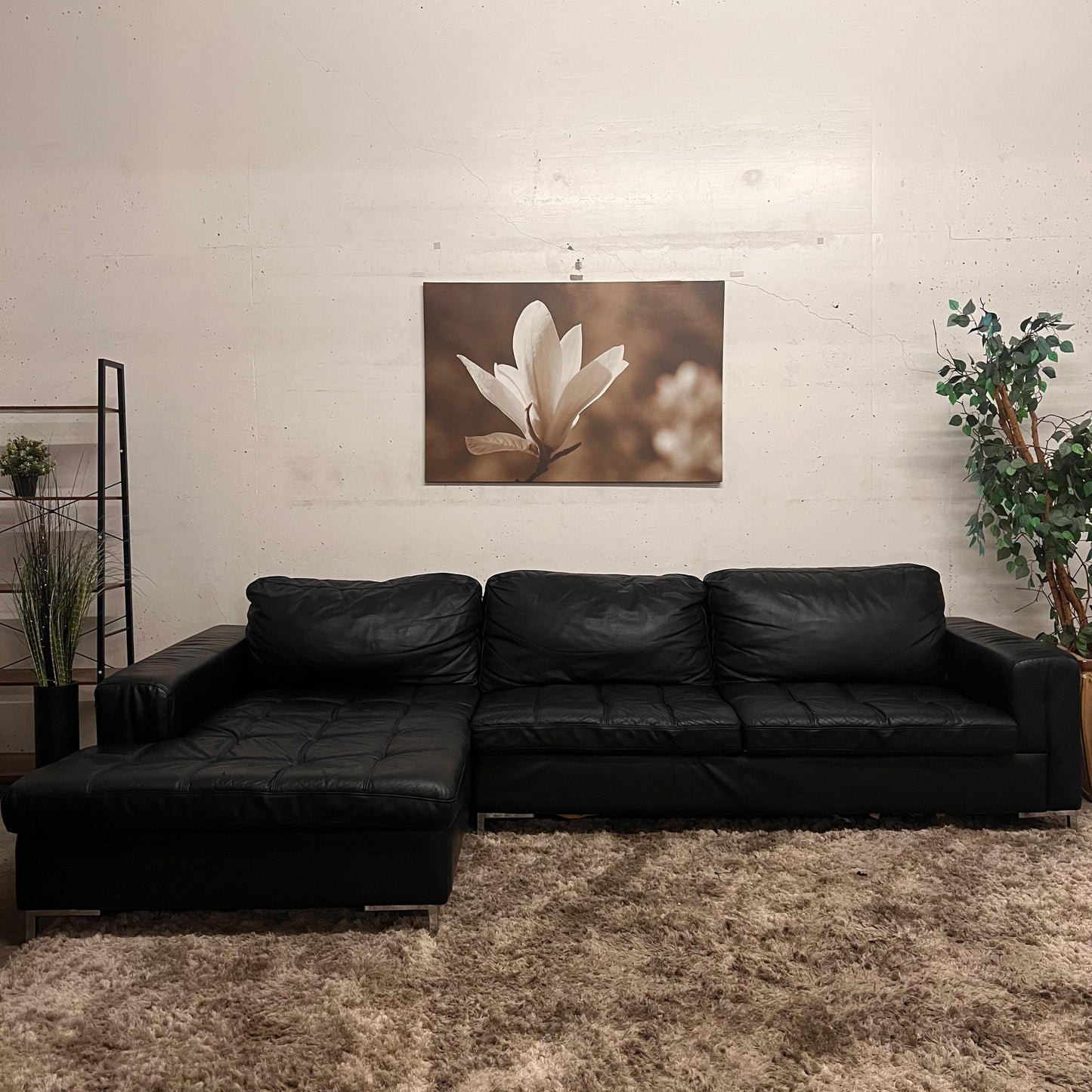 Black leather sectional. L shaped sofa couch.