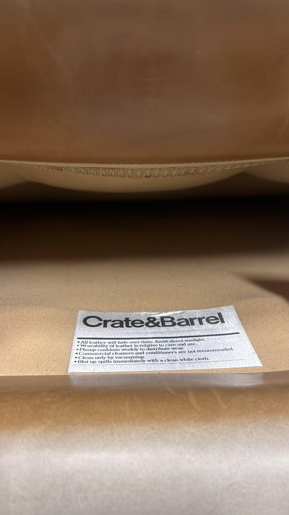 Crate and barrel caramel leather chair.