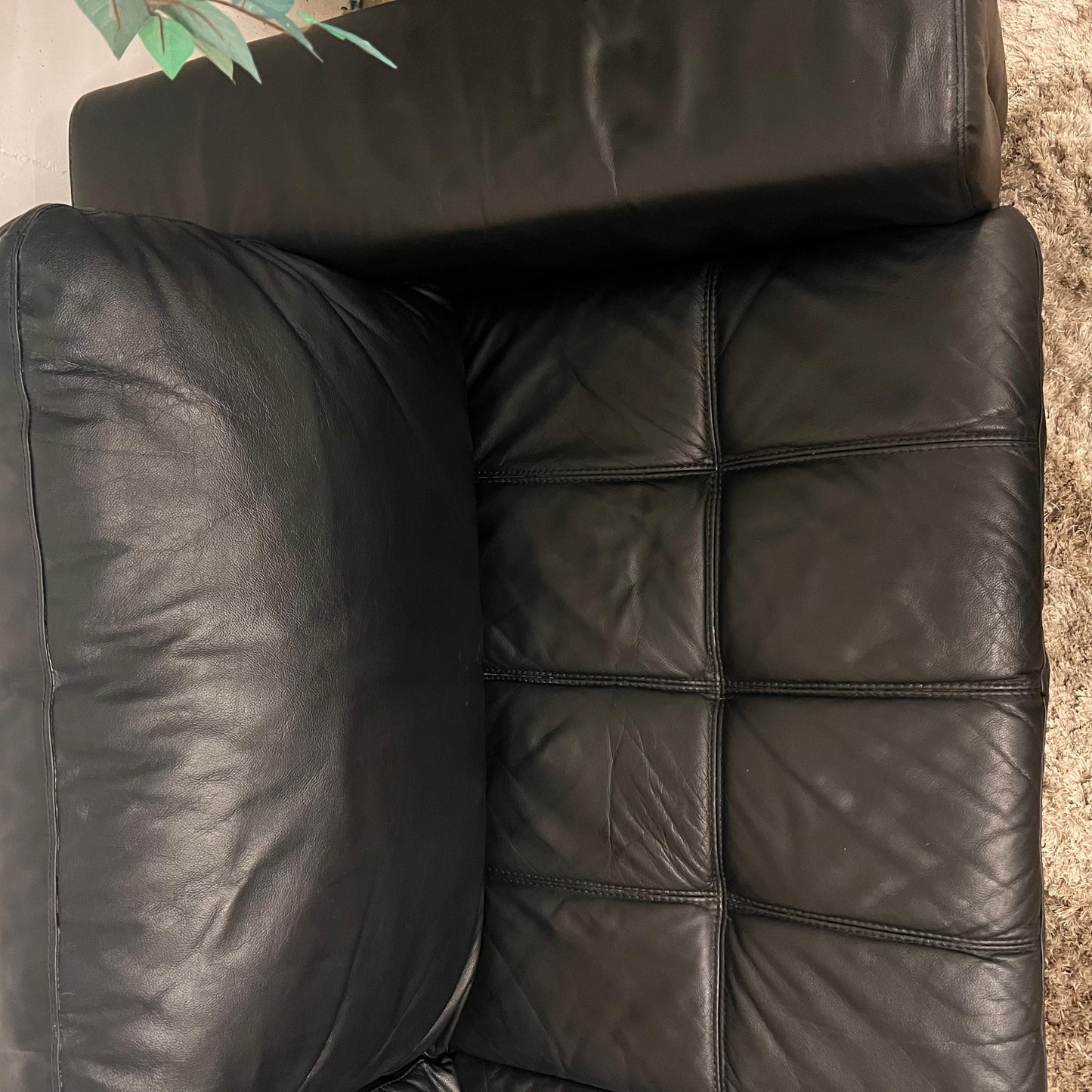 Black leather sectional. L shaped sofa couch.