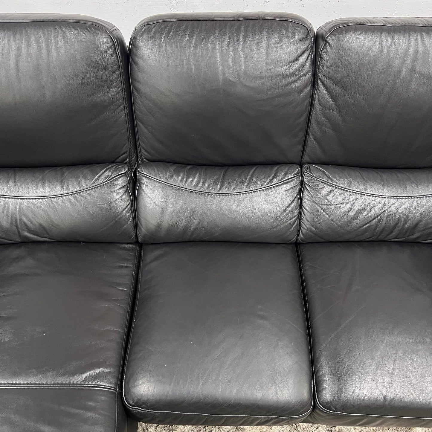 Black leather sectional. L shaped sofa couch. Delivery available