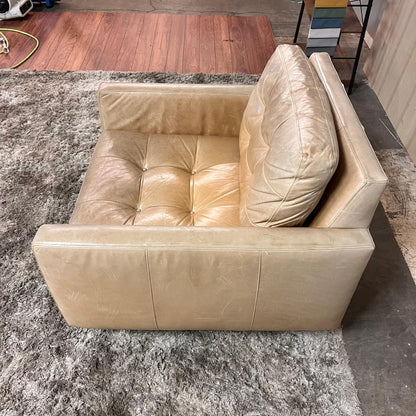 Crate and barrel caramel leather chair.