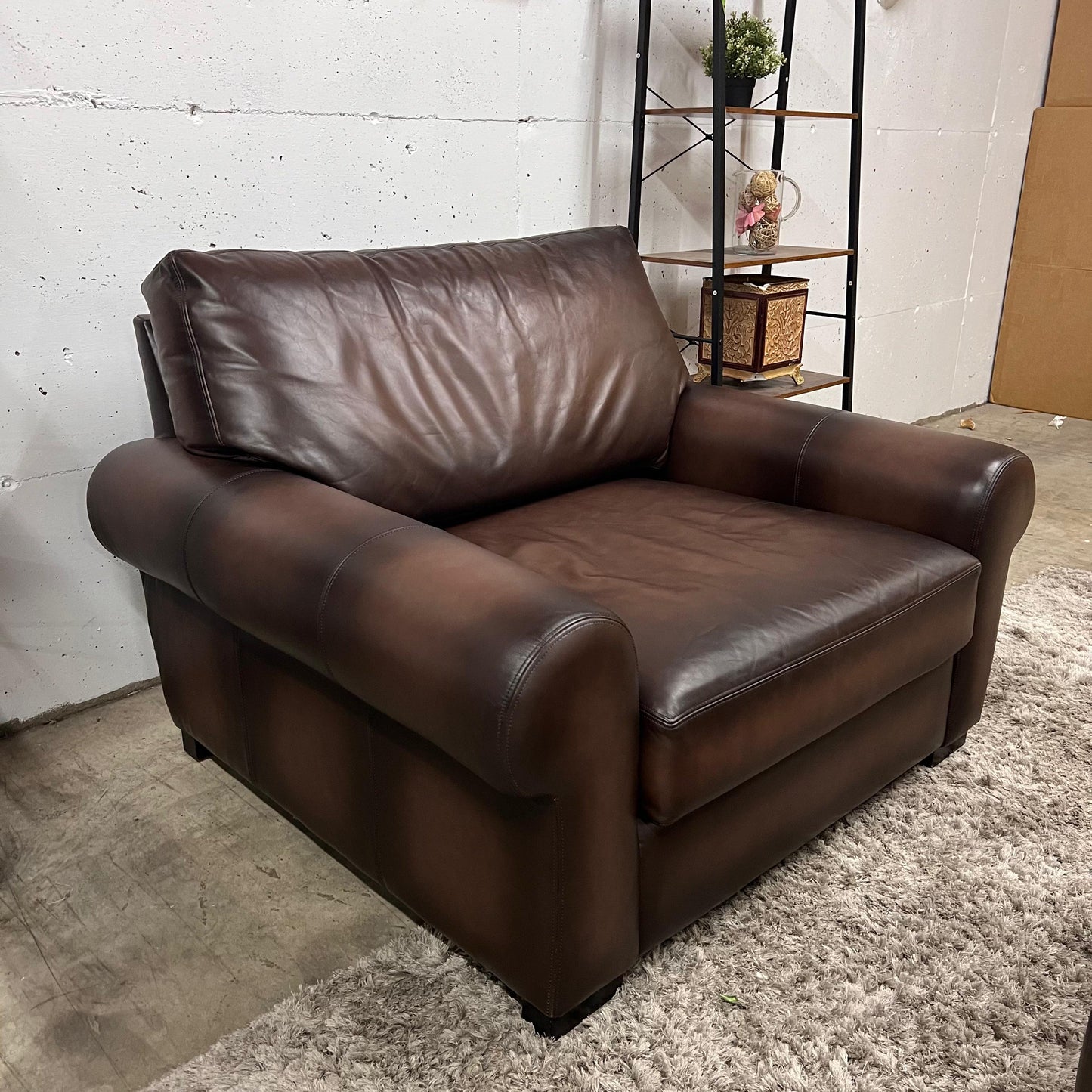 Pottery barn leather chair and a half.