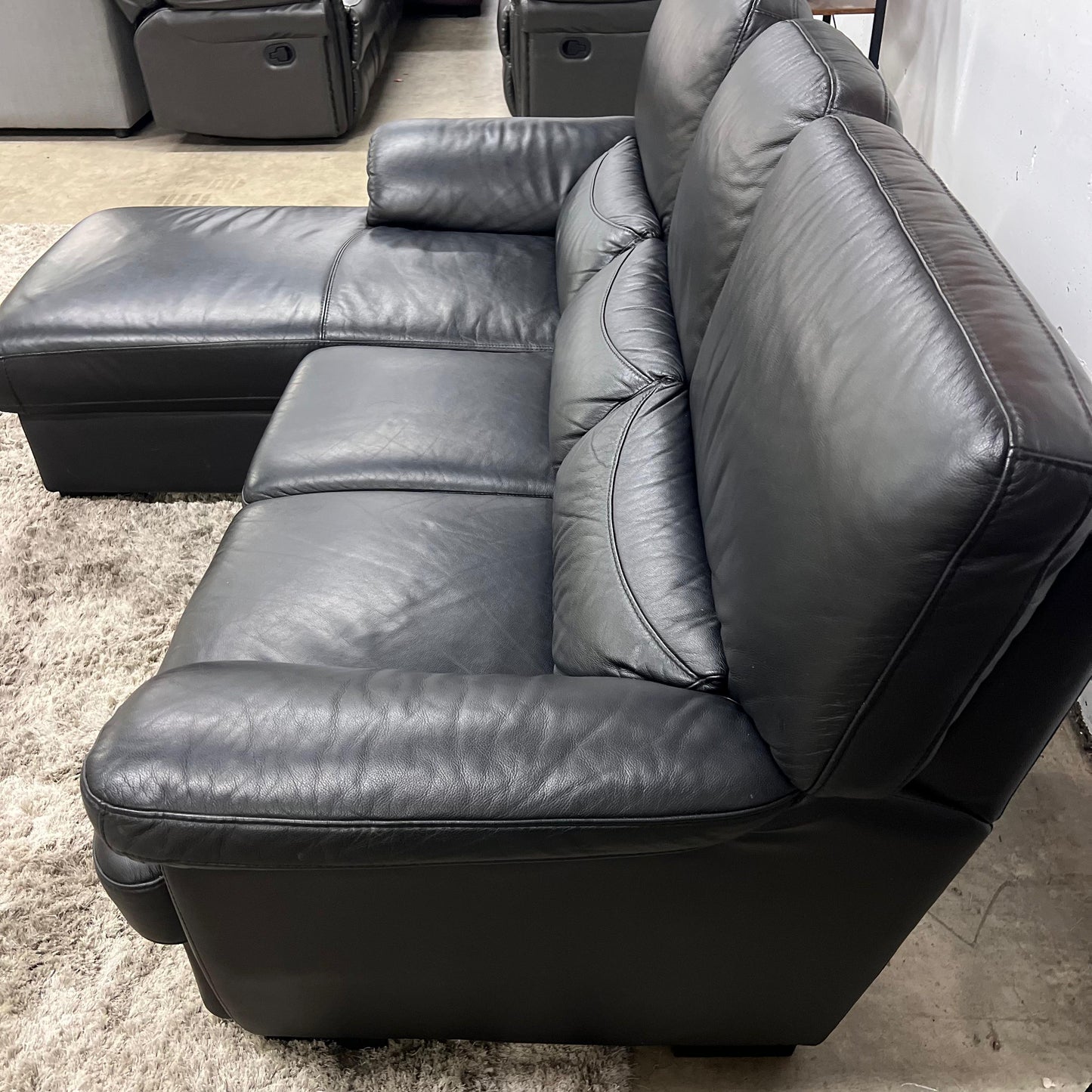 Black leather sectional. L shaped sofa couch. Delivery available