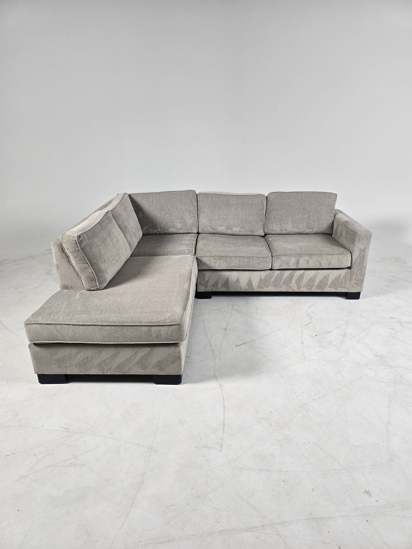 Stylus custom made sectional. Beige L shaped sofa couch.