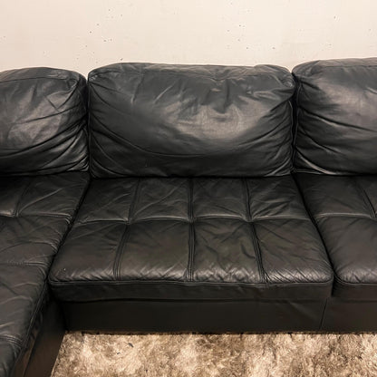 Black leather sectional. L shaped sofa couch.