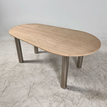 New Moe's fia dinning table. travertine. Retails for $3199