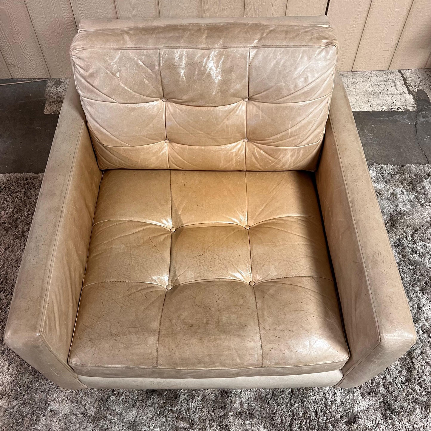 Crate and barrel caramel leather chair.