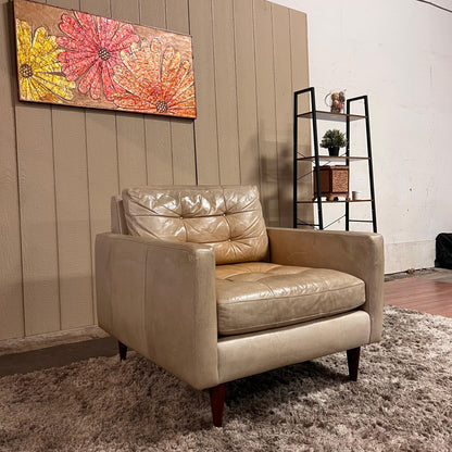 Crate and barrel caramel leather chair.