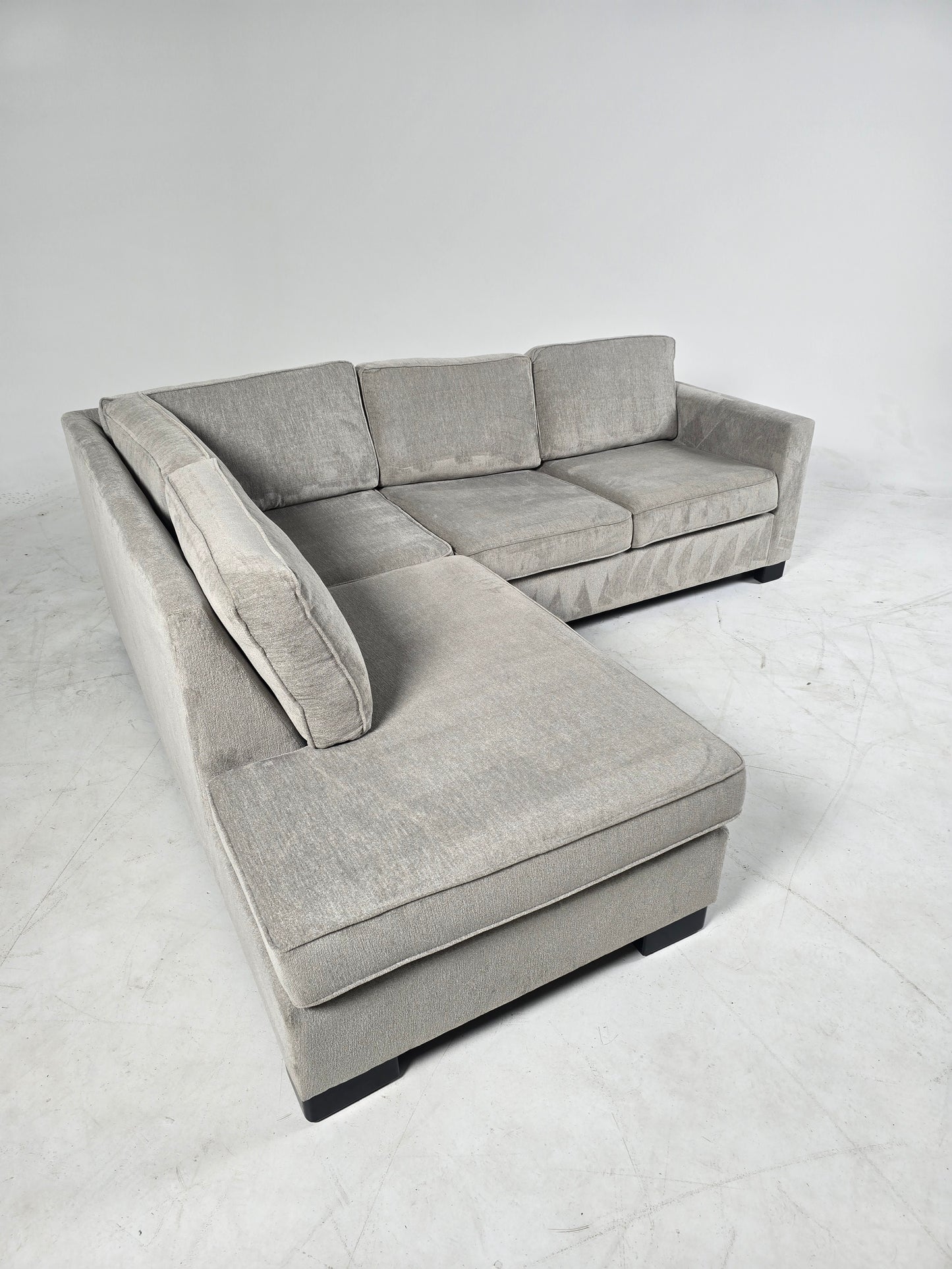 Stylus custom made sectional. Beige L shaped sofa couch.