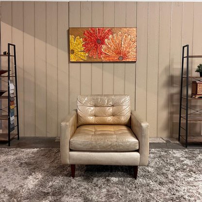 Crate and barrel caramel leather chair.