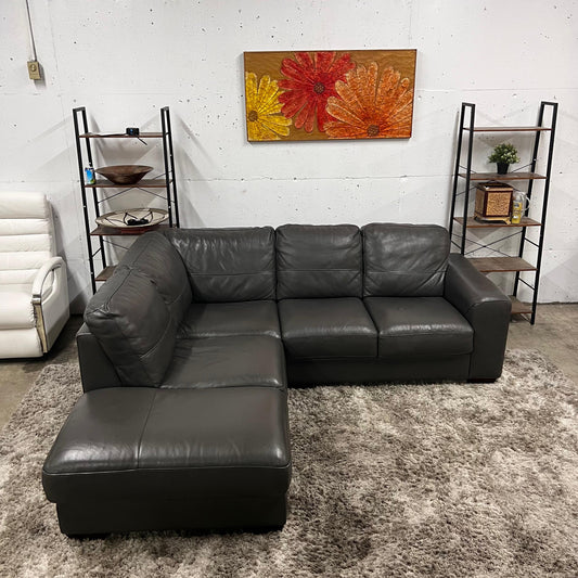 Grey leather sectional. L shaped sofa couch.